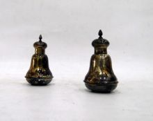 Pair of Edwardian silver pepperettes of baluster form with ribbed rounded base and spirally wrythen