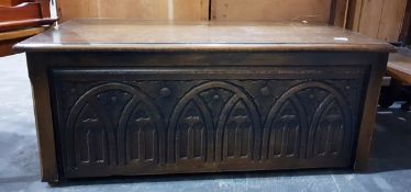 Reproduction oak coffer with carved front,