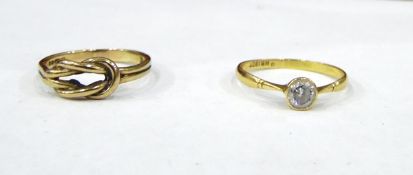 18ct gold solitaire ring set with single white stone (not testing as diamond) and a 9ct gold knot