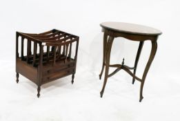 Circular side table on four cabriole supports and a reproduction Canterbury with two drawers below