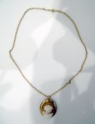Gold-mounted cameo brooch/pendant on a 9ct gold chain,