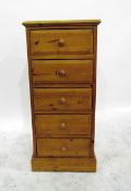 Modern pine chest of five drawers (a baton has been screwed onto the right hand side and a ceramic