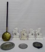 Pair of 19th century cast iron door stops, lions rampant, painted white and two others,