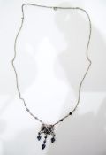 18ct white and yellow gold, sapphire and diamond pendant necklace, bow-shaped, with sapphire drops,
