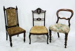 Victorian mahogany revolving piano stool on scroll tripod supports,