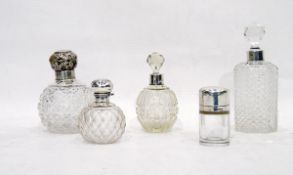 Set of cut glass and silver-mounted dressing table bottles and jars