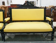 Ebonised wood drawing room suite of five pieces viz:- three-seater settee having carved