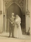 1953 figured satin wedding dress, cream, with veil, accessories, a photograph and a quantity of