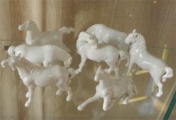 Set of seven white ceramic model horses, 12cm high approx (7)