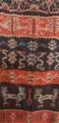 Indonesian woven Sumba hanging, animal and serpent decorated, in cream, blue, red and brown, 170cm