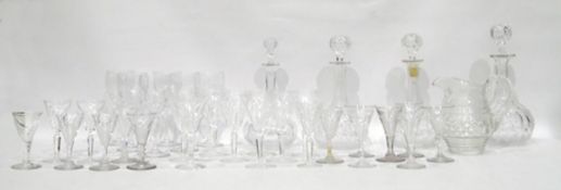 Quantity of cut glass wines with panelled tapering bowls, various sizes, cut glass water jug, cut