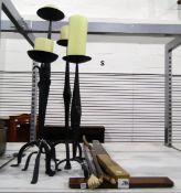 Two pairs of cast iron candle sconces, a walking stick with carved handle of hand holding a ball,