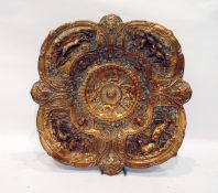 19th century heavily cast copper dish of petal design, with the border panels depicting deer,