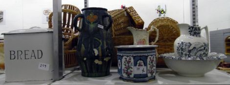 Ewer and basin, another ewer, a planter, a large Doulton-style three-handled vase (damaged) and an