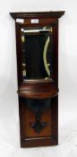 Mahogany-framed wall valet with bevelled plate vanity mirror and bracket shelf