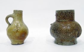 Bellarmine stoneware jug (handle missing and damaged), decorated with shield and grotesque masks