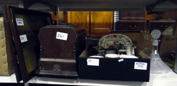 Two cut glass decanters, assorted ceramics, a sewing machine and two framed prints