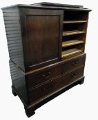 19th century mahogany linen chest having four sliding trays enclosed by two panelled doors, over two