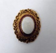 9ct gold, opal and ruby brooch, the cabochon opal