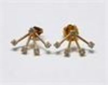 A pair of gold and diamond earrings, a central diamond with four diamond drops