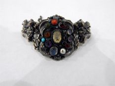 Continental silver coloured metal and semi precious bracelet, the central plaque with scroll