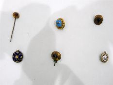 Gold coloured metal and almondine stick pin, three