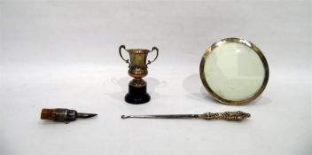 Circular silver photograph frame with trestle supp