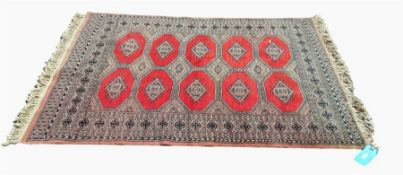 A Persian rug, orange ground with elephant guls an