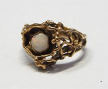 Modern 9ct gold and opal set ring, 5.3g in total