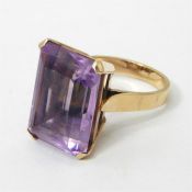 LOT WITHDRAWN Gold and amethyst set ring, the large rectangular emerald cut amethyst 18mm x 14mm,