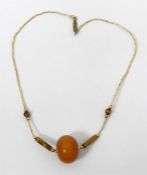 Gold-coloured and amber-coloured beaded necklace,