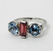 LOT WITHDRAWN White gold, aquamarine and tourmaline set ring, the central stepped cut tourmaline