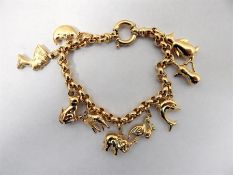18ct gold belcher link charm bracelet, having nume
