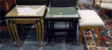 Nest of three stained as mahogany tables with tool