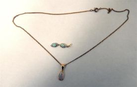 18ct gold and opal drop-shaped pendant on a gold-c