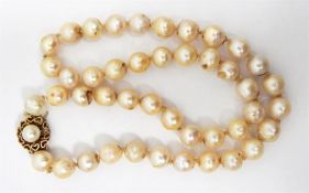 LOT WITHDRAWN String of cultured pearls, 9ct gold clasp, approx 44cm across (some pearls chipped)