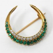 18ct yellow gold crescent brooch set with emeralds