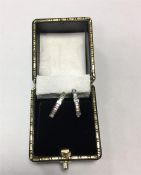 Pair 18ct white gold and diamond hoop earrings