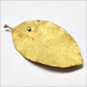 1970's Grima 18ct gold leaf brooch with single diamond, 14.7g in total