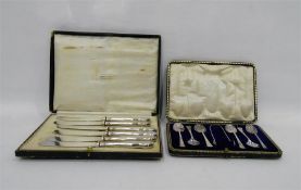 Set of six silver coffee spoons with matching spoo