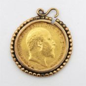 Edwardian half sovereign, 1909, mounted on a gold