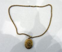 Gold coloured metal and ornate belcher link chain,