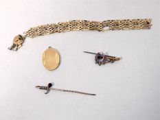 Gold locket, oval and engine-turned, two stick pin