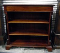 Dwarf mahogany three-tier open bookcase having tur