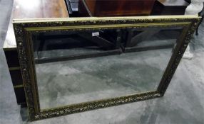 Rectangular bevelled plate wall mirror within a mo