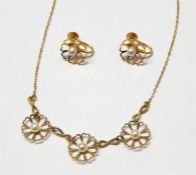 9ct gold necklace with flower detail and central c