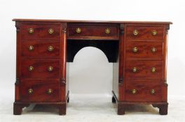 Mahogany kneehole desk having an arrangement of ni