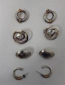 Four pairs of modern silver earrings