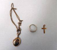 Gold locket, oval and floral engraved, on chain, a