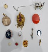 Gold-coloured Victorian brooch, a silver butterfly brooch, opal and gem set,  a gold-coloured